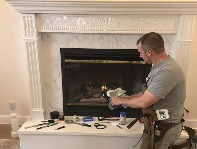 Barberton Chimney Sweep performing fireplace maintenance in Barberton, OH