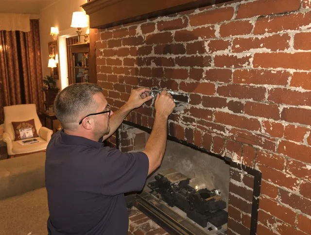 Barberton Chimney Sweep expert fixing a fireplace in Barberton, OH
